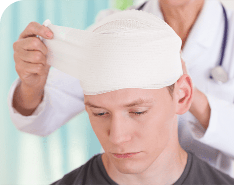 doctor wrapping head of man with a tbi