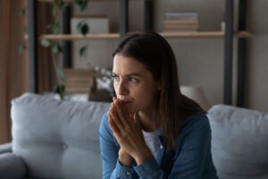 A concerned woman wondering if car insurance companies pay for lost wages after an accident.